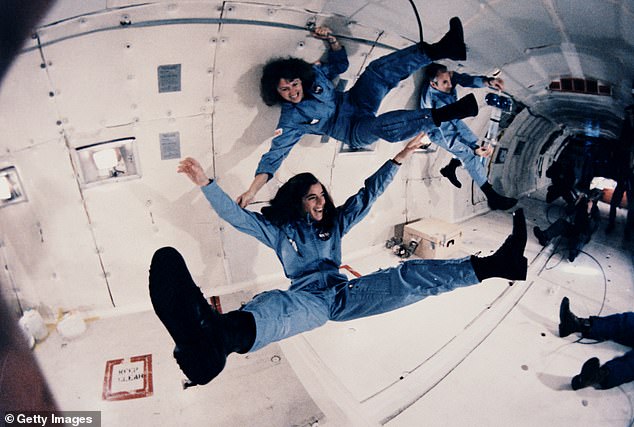 Members of the crew preparing themselves for the space mission by experiencing zero gravity