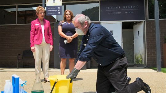 Karl gets rid of the stink bomb at Eirini Rising as Susan and Terese watch on in Neighbours