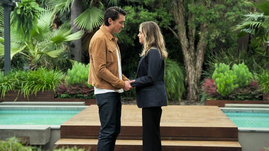 Leo holds Kristas hand in Neighbours